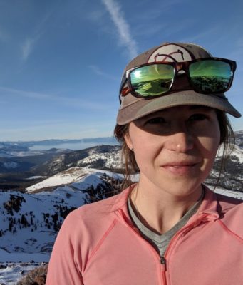 Image of Mariah Coley in front of blue sky and mountains